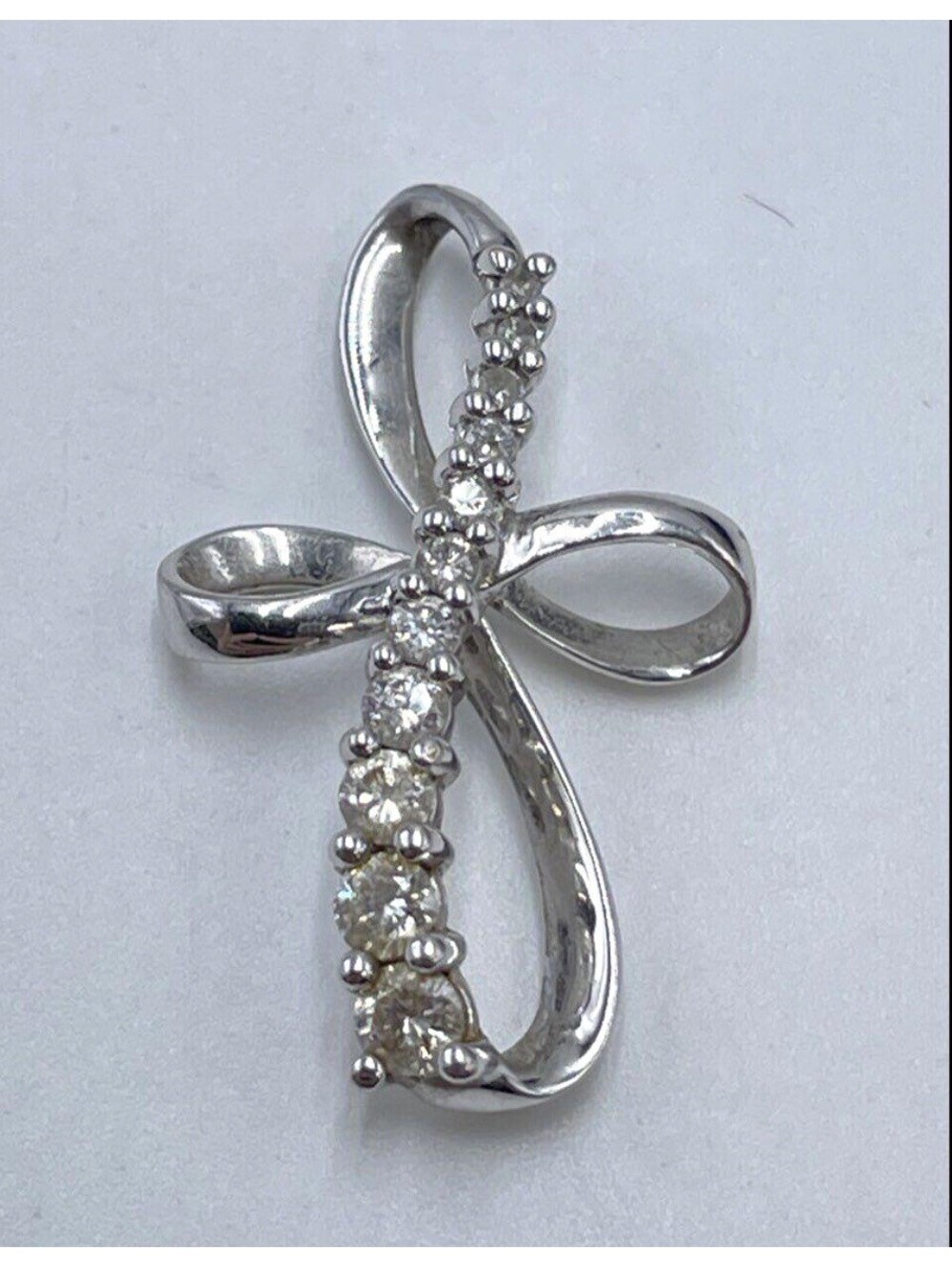 10K White Gold Diamond Stylized Ribbon Infinity Cross Pendant 1.13g
